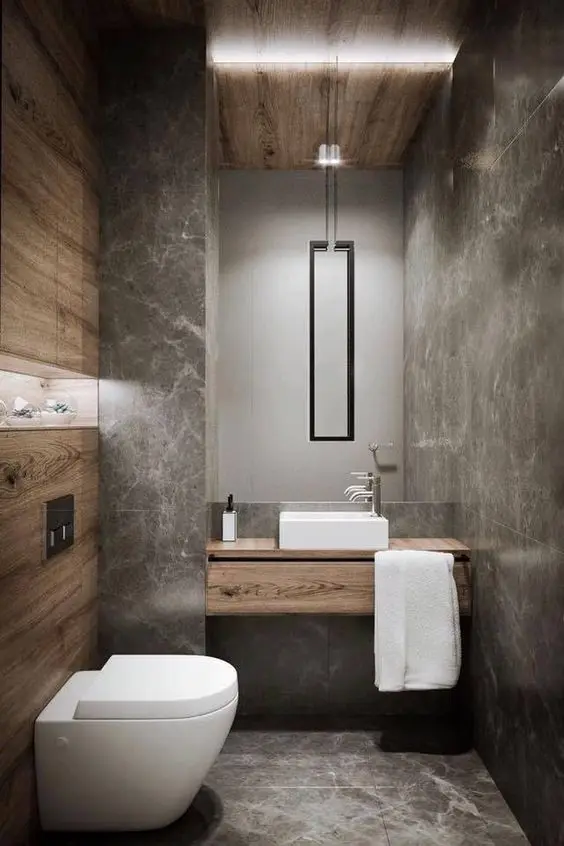 Cool Contemporary powder room: Tame down the blunt look of modern designs and make it look less intimidating by adding