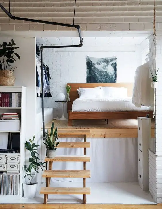 small apartment with raised bed