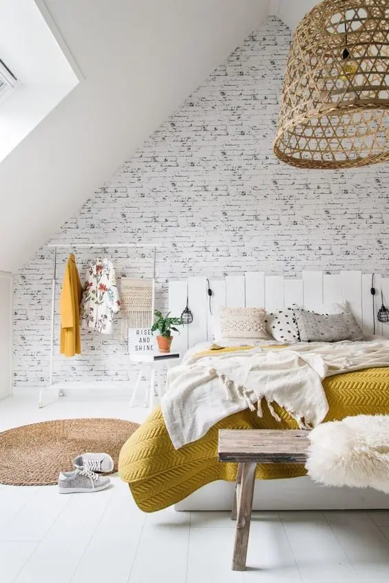 Rustic Farmhouse loft bedroom: This is a modern home with a lot of country charm and style. The rough white brick wall