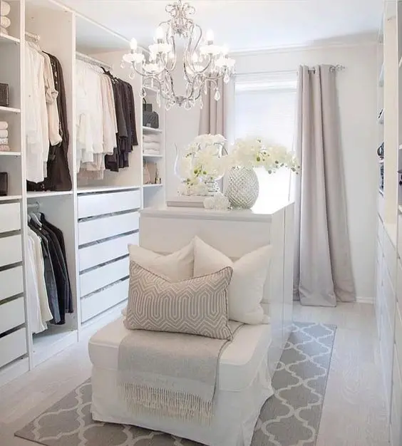 Clean and Cosy bedroom closet: White with few touches of light greys and blush. Despite its size, this closet offers a lot