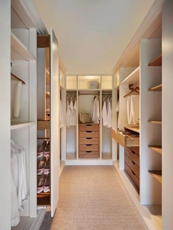 Wood and White bedroom closet: Classy, modern and timeless. The white interiors help brighten up the room, while its wood