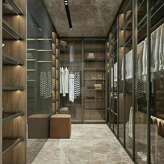 Glass and Marble Luxury bedroom closet: Luxurious, elegant and structured. The cultured sheen of marble complements the