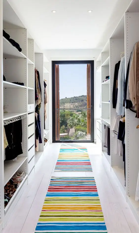 A Glass Wall bedroom closet: Break away from the traditional dank and dark closets. A glass wall to one end of your closet