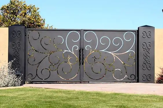 Lasered Steel front gate: Curved laser cuts turn a flat grey steel sheet into something worth slowing down for