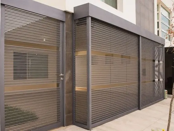 Driveway Metal Screen front gate: A roll-up metal screen for the driveway, so there's no swing arc and no slider track across the path