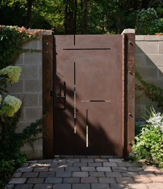 Laser Cut Metal front gate: One bare metal sheet, a precise cut pattern, ordinary hinges and a latch