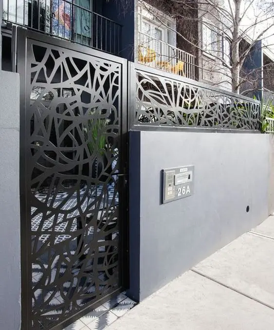 City Black Gate: A solid wall for privacy with a black steel gate breaking it up