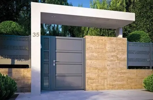 Entrance and Pergola front gate: A small pergola over the gate frames the entry, carries the light fitting