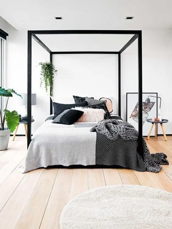 Chic and Canopy bedroom: Delightful, modern and stylish. This bright and airy room gets its chic flair from the sleek black