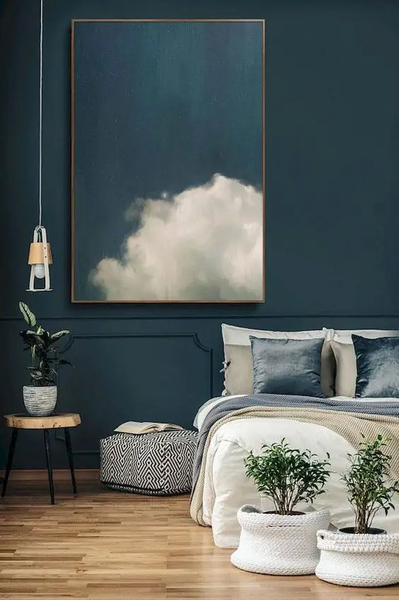 Dark Skies bedroom: The Prussian blue wall is modish, modern and stunning. It brings in a calming and cool effect to the