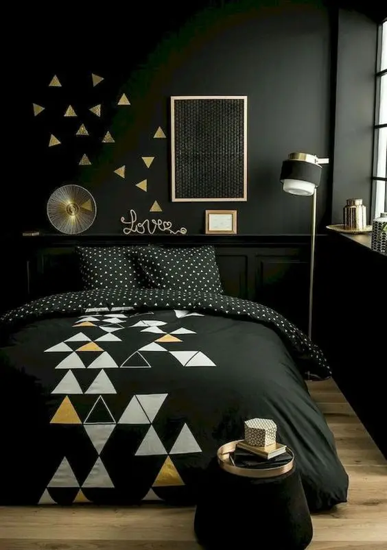 Cosy Black bedroom: Goth, dramatic, modern. The light-toned wood flooring gives this modish bedroom a bright relief from its