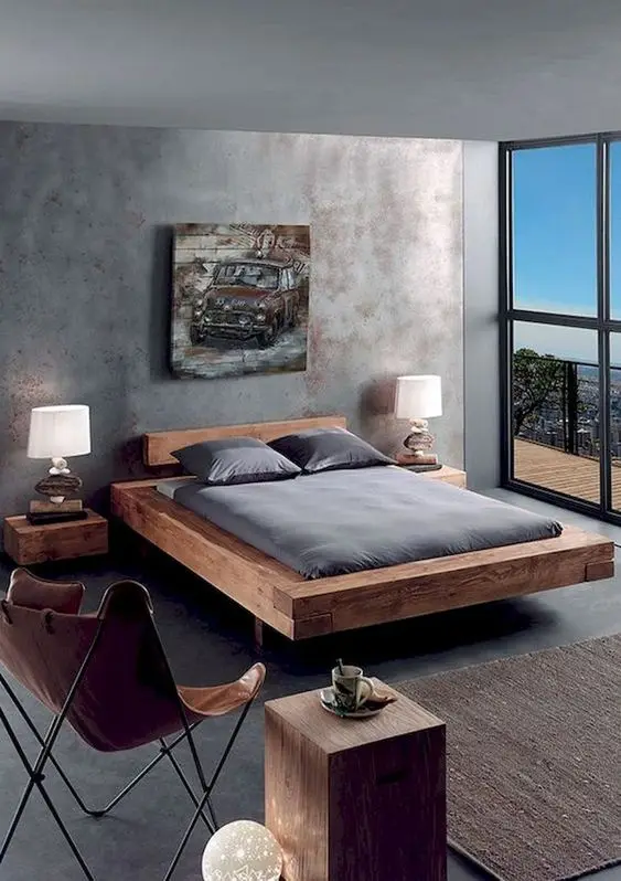 Rustic Mancave bedroom: Dominant, powerful, raw. This mancave keeps everything bare – concrete walls and floors and the wide