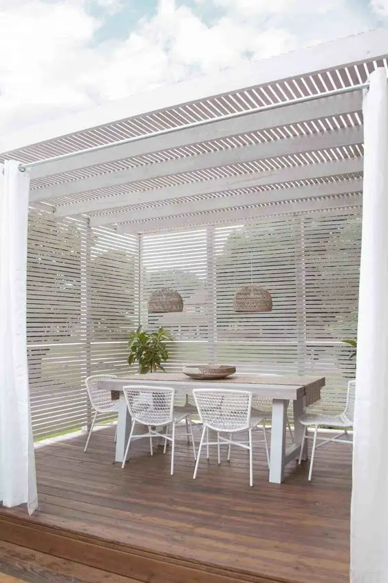 white pergola with screen