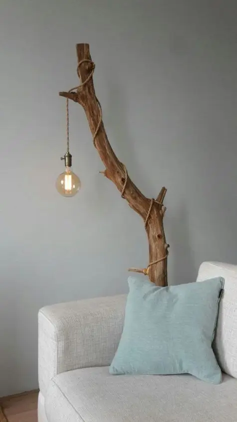 Branch Lamp Stand DIY home décor: No lampstand? No problem. Just find a tree branch that can serve as the stand. Tie a glass