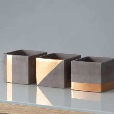 Modern Concrete Planters DIY home décor: Geometric concrete planters are in vogue. The natural shade and basic shapes are in