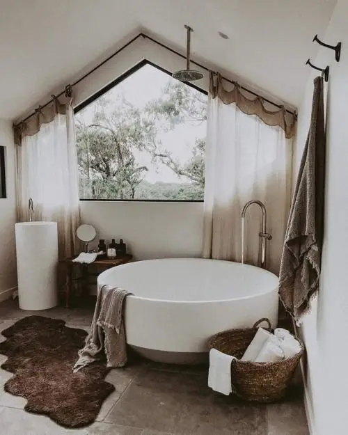 rustic bathroom with a round tub