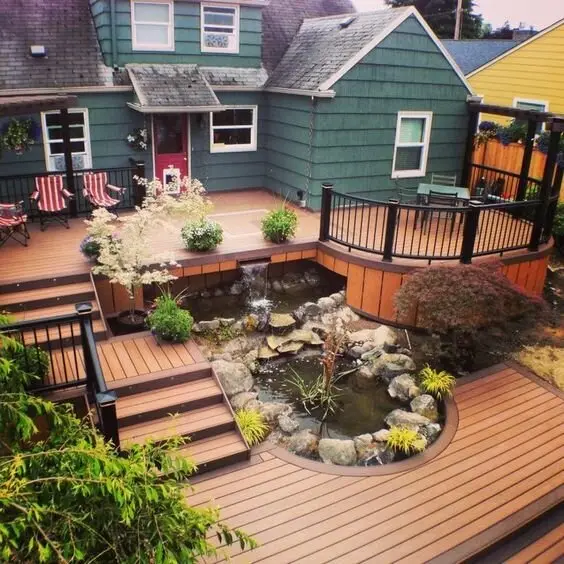 Multi-Level Decking deck and patio: A deck split across levels, with a dining area up top, a viewing platform and a lower