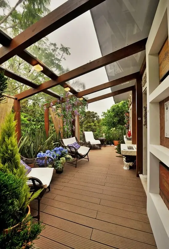 Outdoor Oasis deck and patio: Timber frames, composite decking, a glass roof, and plants packed in on every side. The