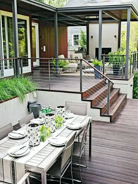 Modern Elegance deck and patio: A traditional timber deck updated with cable balustrade and steel-grey frames. The bones