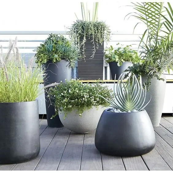 Huge Modern Planters deck and patio: Oversized geometric planters in white, grey or charcoal. Two or three big ones read as