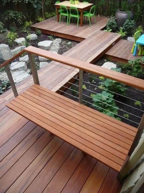 The Backyard Deck deck and patio: Several small decks linked by walkways, with pocket gardens between them. On a sloping or