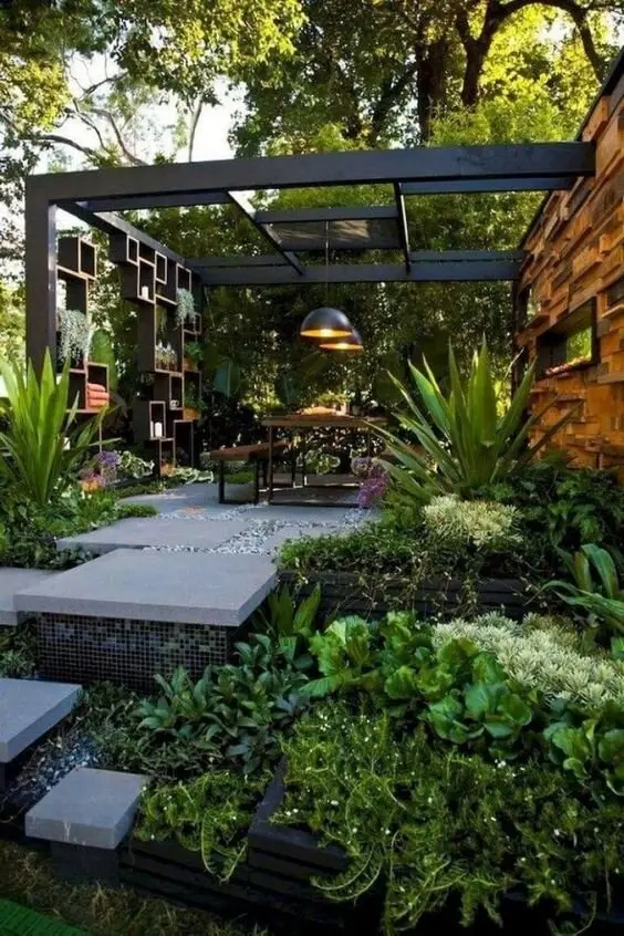 Edgy and Wild deck and patio: If your block backs onto bush, don't clear it. Build into it. Black pergola, stone pavers, a
