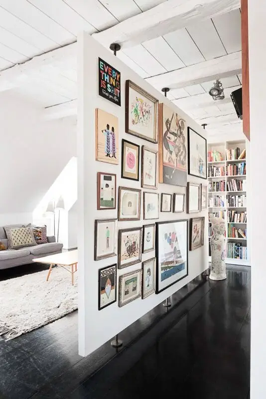 Gallery Wall DIY room divider: Full coverage without installing a wall. This pseudo wall is a raised panel, with spaces