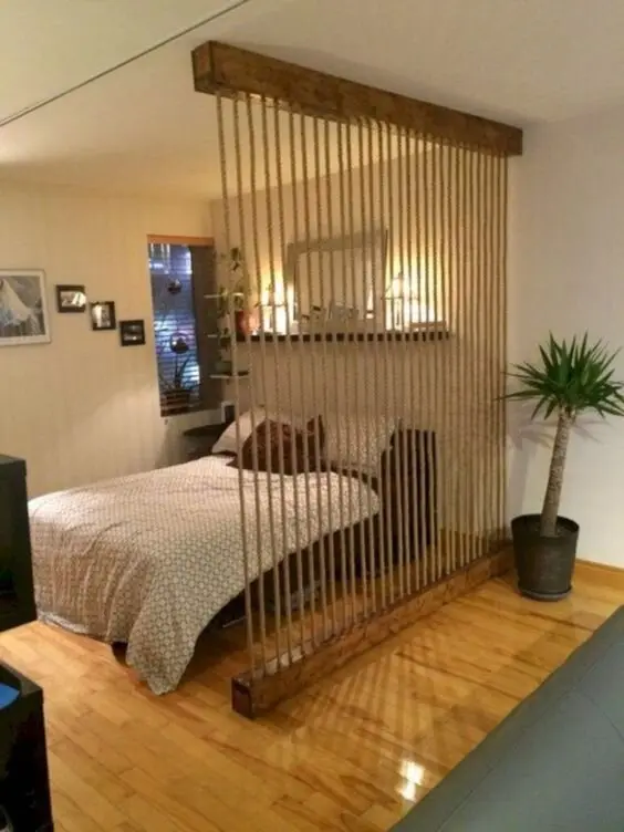 Rustic Rope Screen DIY room divider: A very rustic way to divide one room into dedicated spaces. You will need two wood