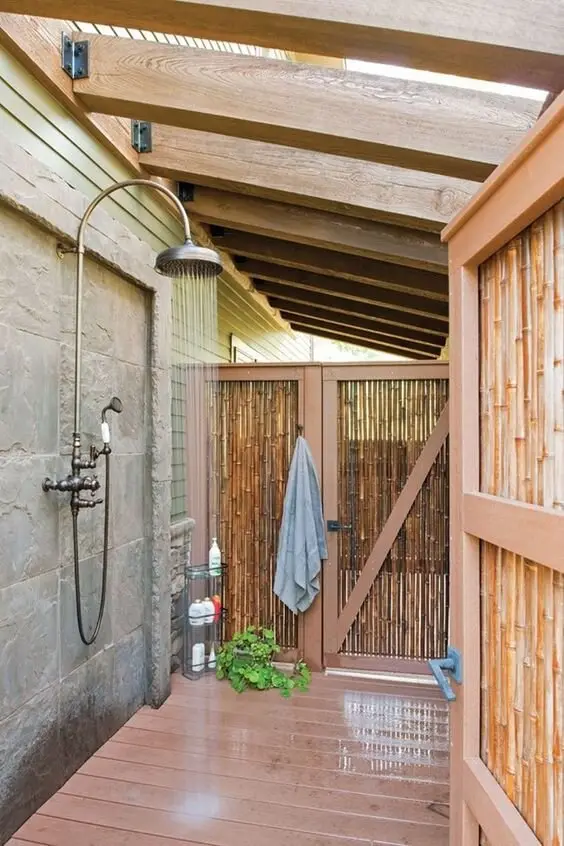 Reed Screens outdoor shower: Rustic beams overhead and reed screening all around. Indoor-bathroom privacy, outdoor