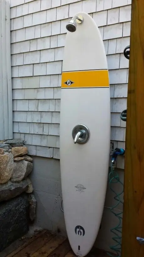 Surfboard Shower: A shower plumbed through an old surfboard against a shingled wall. Pure beach-shack fun. If there's a