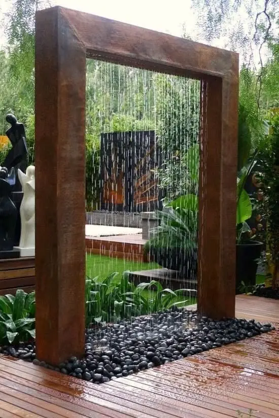 Raining Arch outdoor shower: An arch that rains. When nobody's showering it runs as a garden water feature, which is a