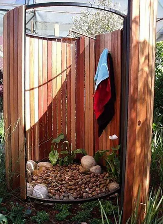 Circular Enclosure outdoor shower: Timber slats curved into a full circle with a door, small enough for a yard corner. Full