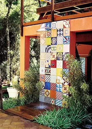 Cheerful Tiles outdoor shower: A wall of patterned Portuguese-style tiles turns the shower into the garden's artwork. It's