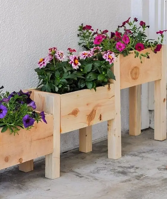 Tiered Flower Boxes wood project: Boxes stepped in tiers along a fence line, lifting the plants toward eye level. Suits