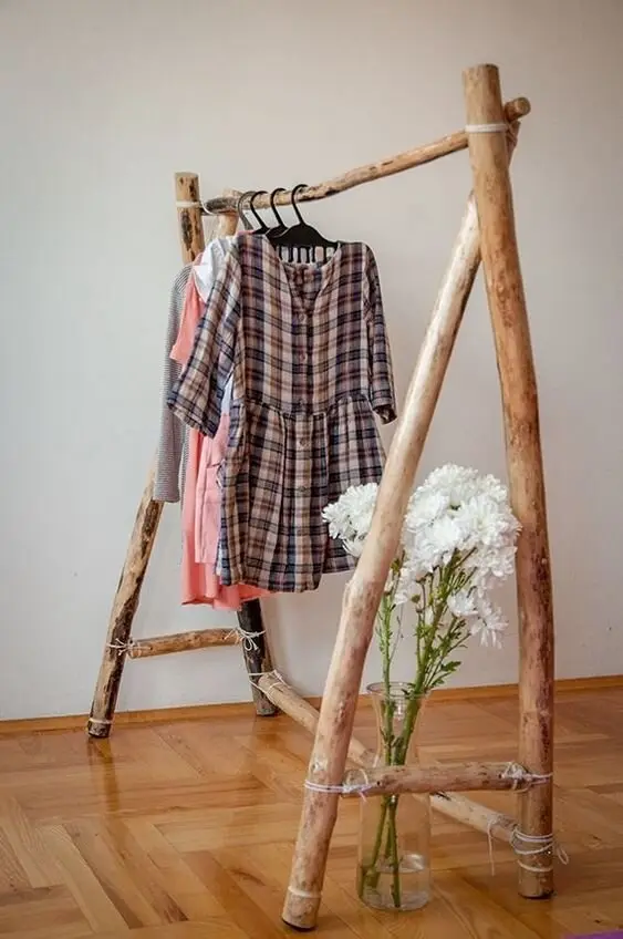 Driftwood Clothes Rack wood project: A driftwood branch hung on cords makes a clothes rack guests comment on. Wash and dry