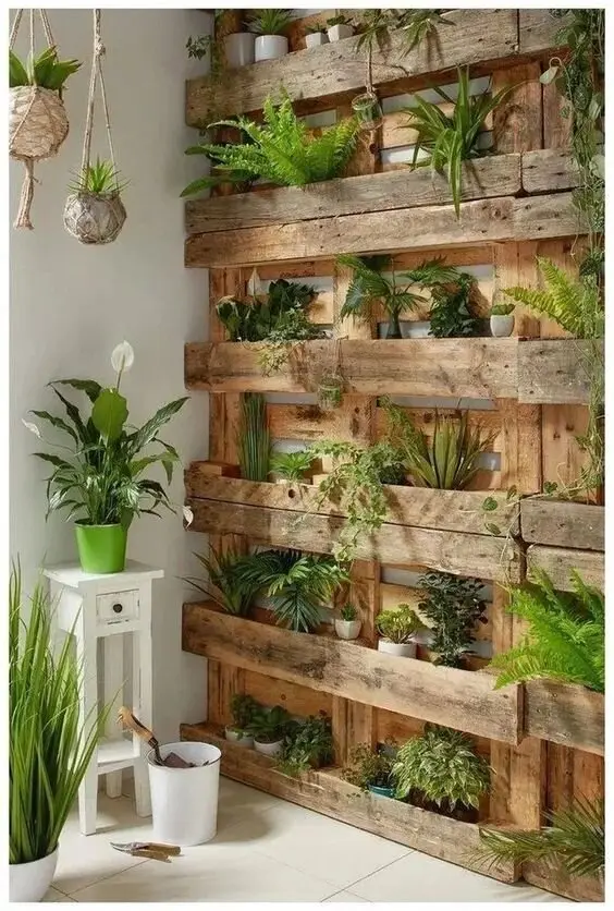 A Pallet Wall Garden wood project: No yard, no problem. A pallet stood against the balcony wall gives you rows of pockets