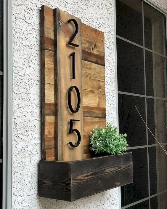 Impressive House Number wood project: Clean planks, a backing panel, hardware-store numbers and a little pocket at the