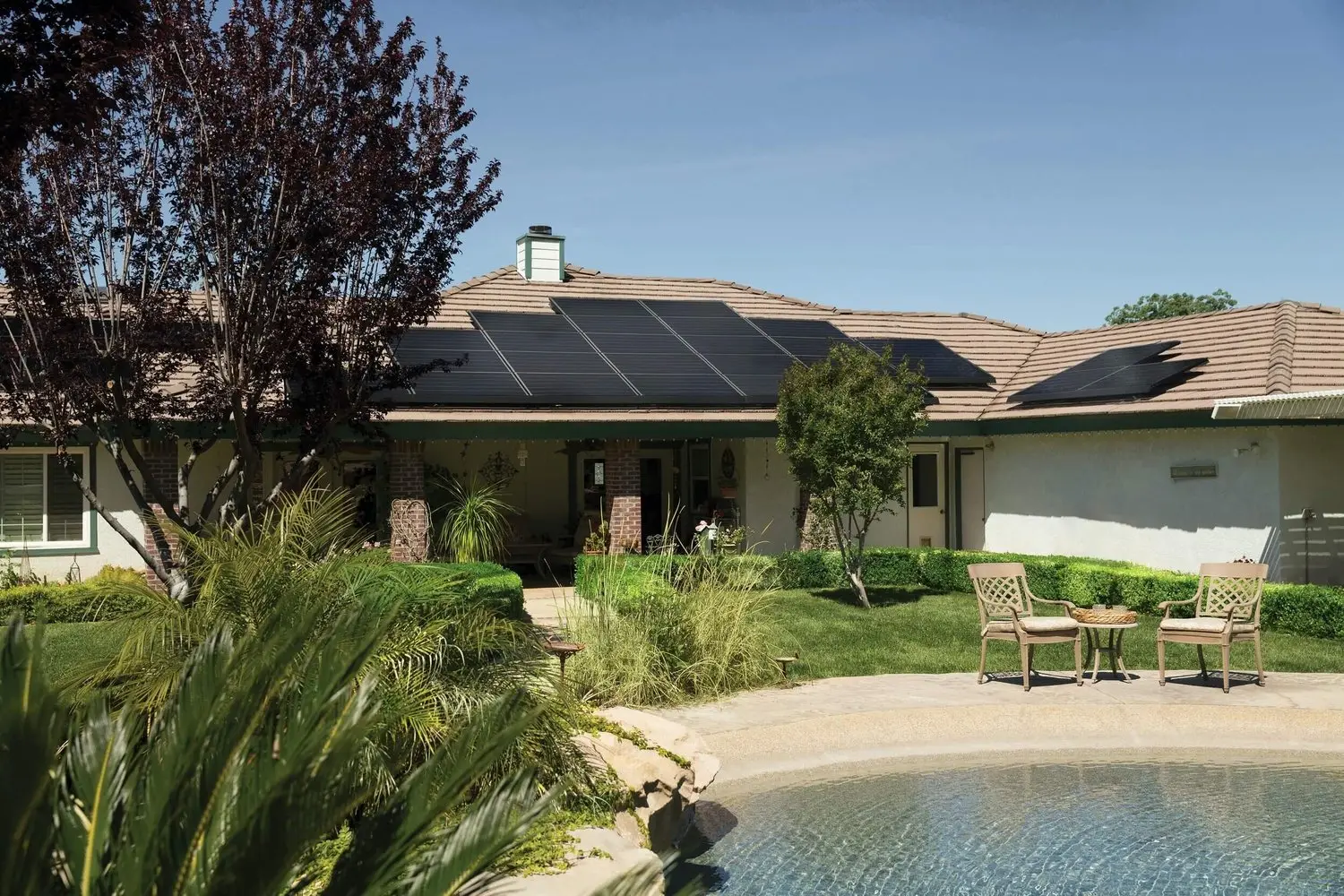 black solar panels on brown roof 2850347