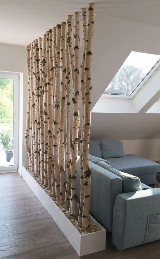 Birch Wall DIY room divider: If you can source birch or any other straight tree branches, you can use them to create a very