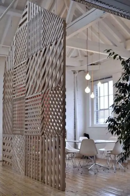 A Wall of Slats DIY room divider: This wall of slats provides maximum screen coverage without totally closing out the room