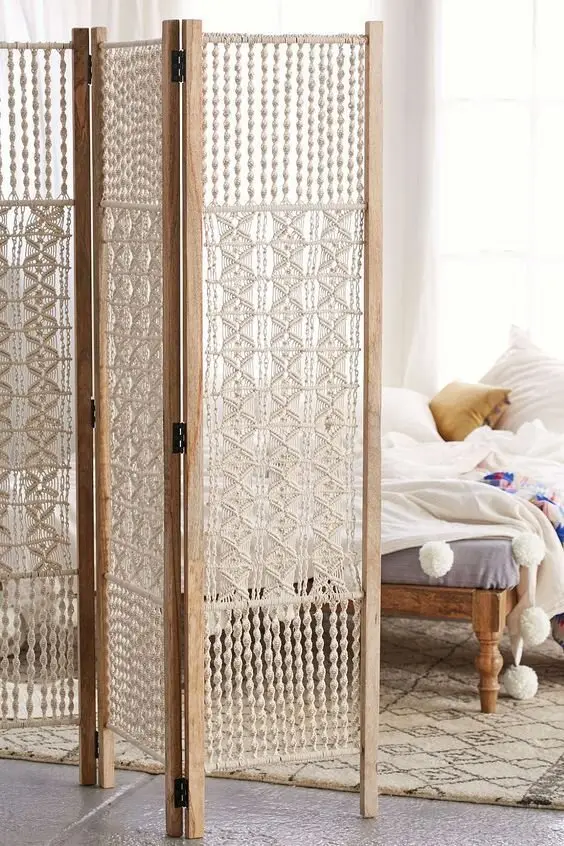 Macramé Screen DIY room divider: Bring in a touch of boho to the room with this charming macramé weave screen. An easy DIY