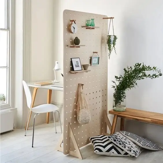 Functional Pegboard DIY room divider: An easy DIY for an extremely functional room divider. Instead of installing a pegboard