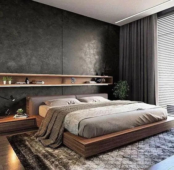 Urbane Gentleman bedroom: Dark grey walls and rug, warmed by a timber platform bed with built-in side tables and a shelf