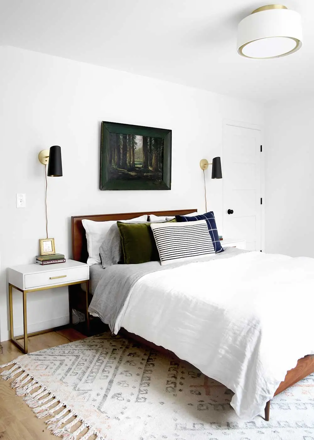 Cool White bedroom: An all-white room that still reads masculine because the lines are square and the styling is spare