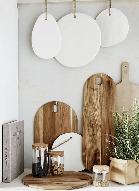 Rustic Vignette farmhouse kitchen: A vignette is a small staged corner: chopping boards leaned against the splashback