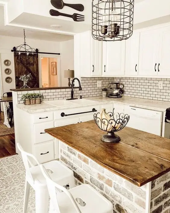 Industrial Chic farmhouse kitchen: A butcher's block, white walls and classic cabinets on the farmhouse side; metal accents