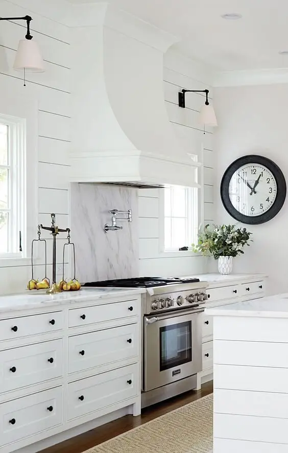 Shiplap Walls farmhouse kitchen: Shiplap on the walls and island panelling, with black accents. Here, VJ lining boards from
