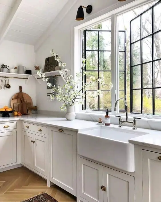 Open Windows farmhouse kitchen: Glass-paned windows that read open even when shut, with curtains for when privacy matters