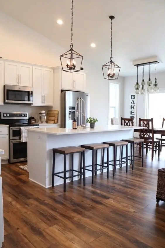 Rustic Floors farmhouse kitchen: Dark timber boards under an otherwise modern kitchen. Floors carry more of a room's