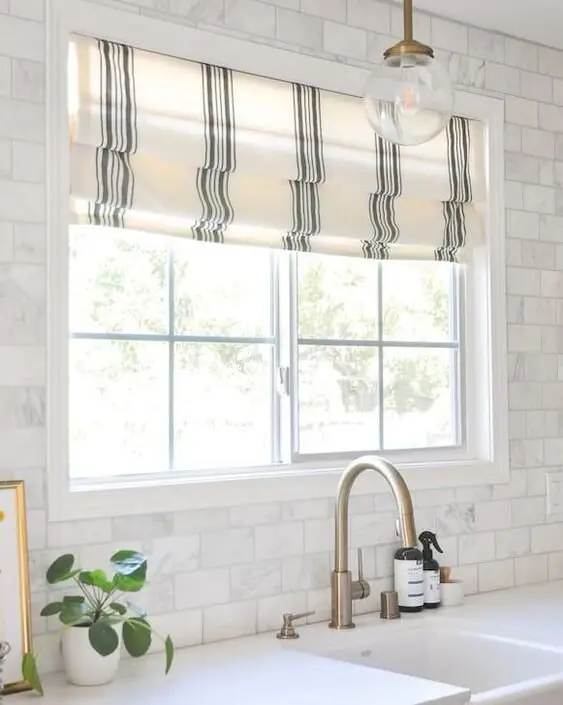 Roman Shades farmhouse kitchen: If gingham curtains feel too country, a plain roman shade in a coastal stripe does the same